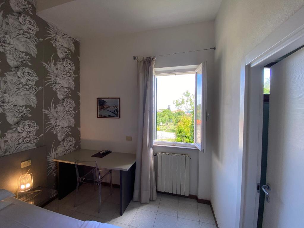 Postel nebo postele na pokoji v ubytování Hotel Casa Lupi