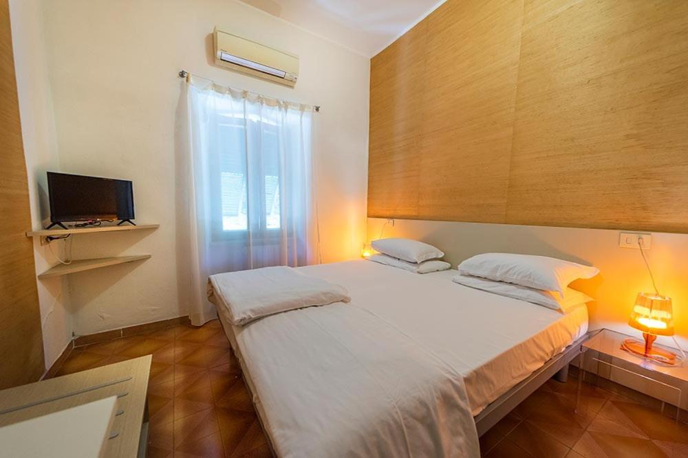 Postel nebo postele na pokoji v ubytování Hotel Casa Lupi