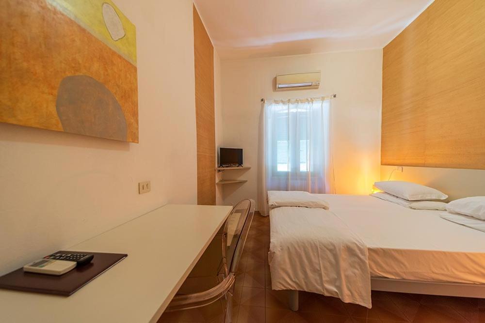 Postel nebo postele na pokoji v ubytování Hotel Casa Lupi