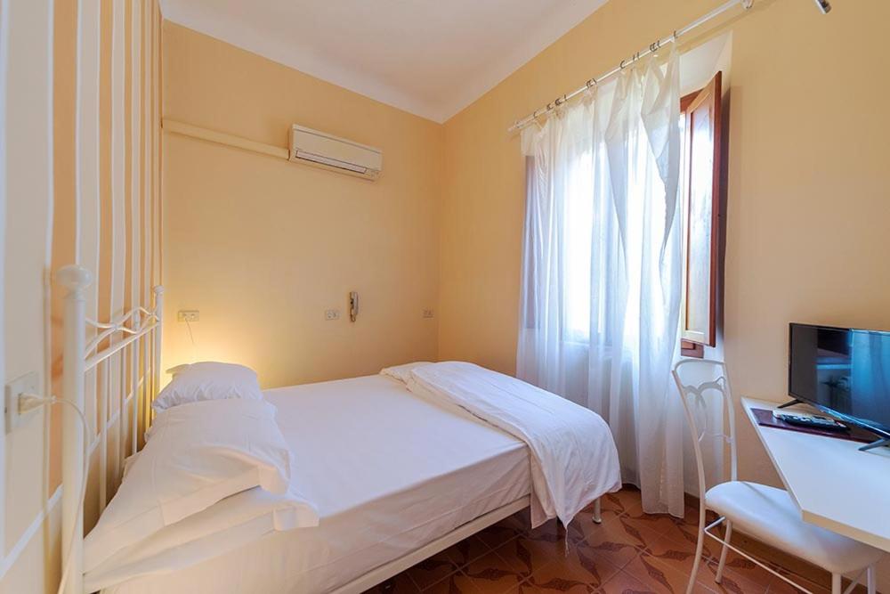 Postel nebo postele na pokoji v ubytování Hotel Casa Lupi