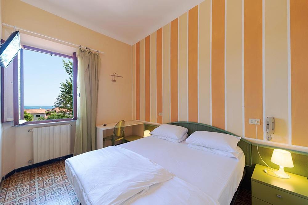 Postel nebo postele na pokoji v ubytování Hotel Casa Lupi