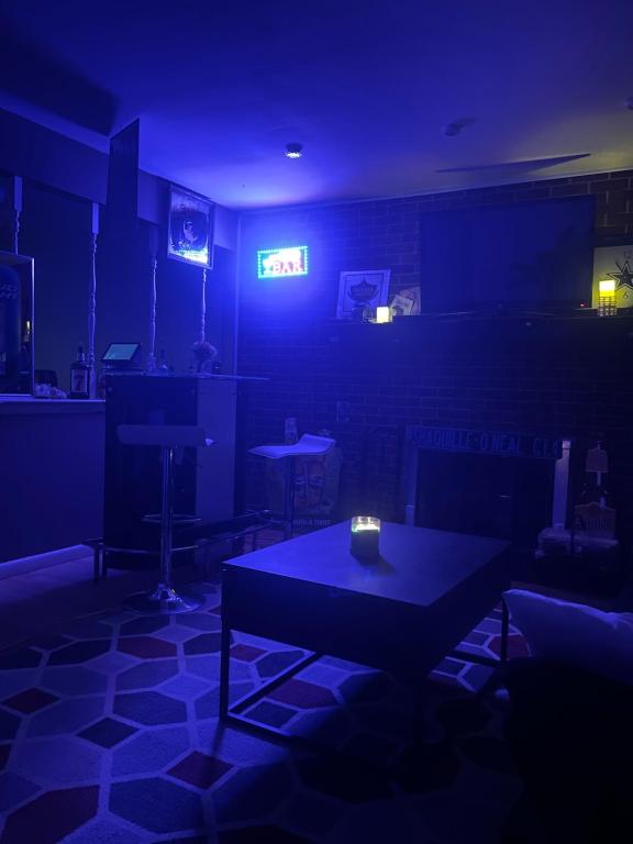 a dark room with a table with a candle on it at Dayton get away in Dayton