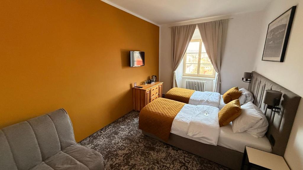 Postel nebo postele na pokoji v ubytování Hotel Tynec