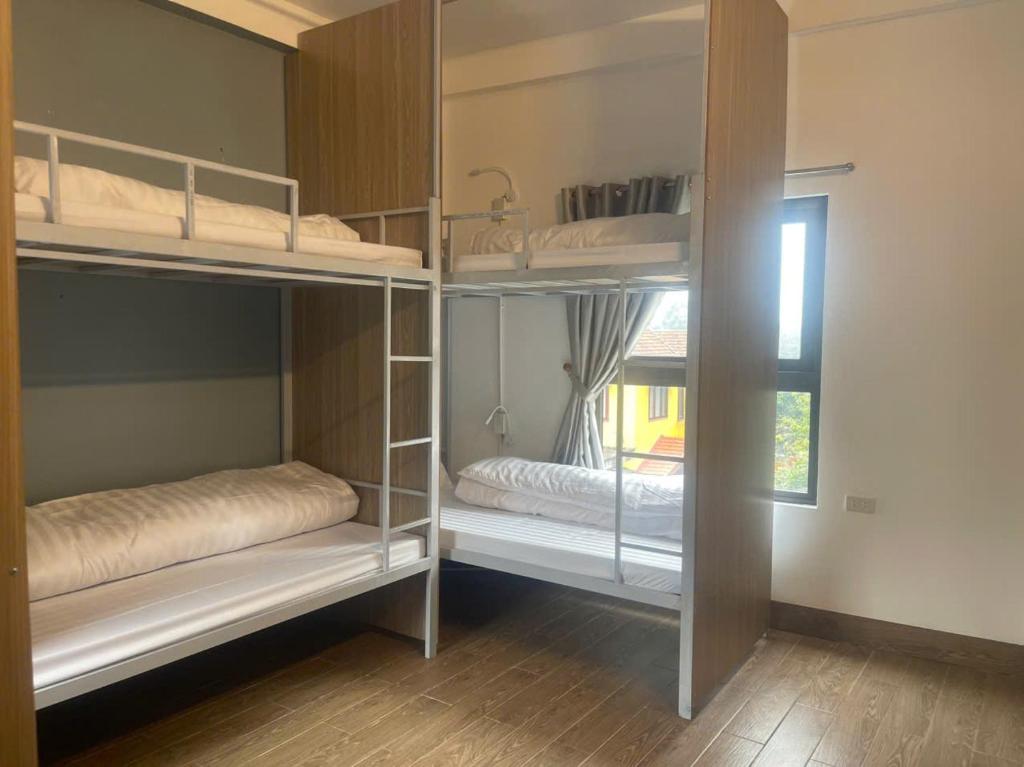 Postel nebo postele na pokoji v ubytování Tamcoc Backpackers Hostel Homestay