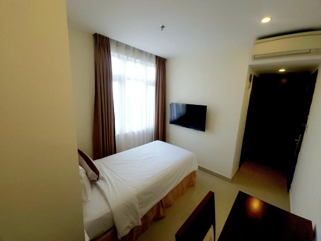 TV a/nebo společenská místnost v ubytování Lychees' Hotel