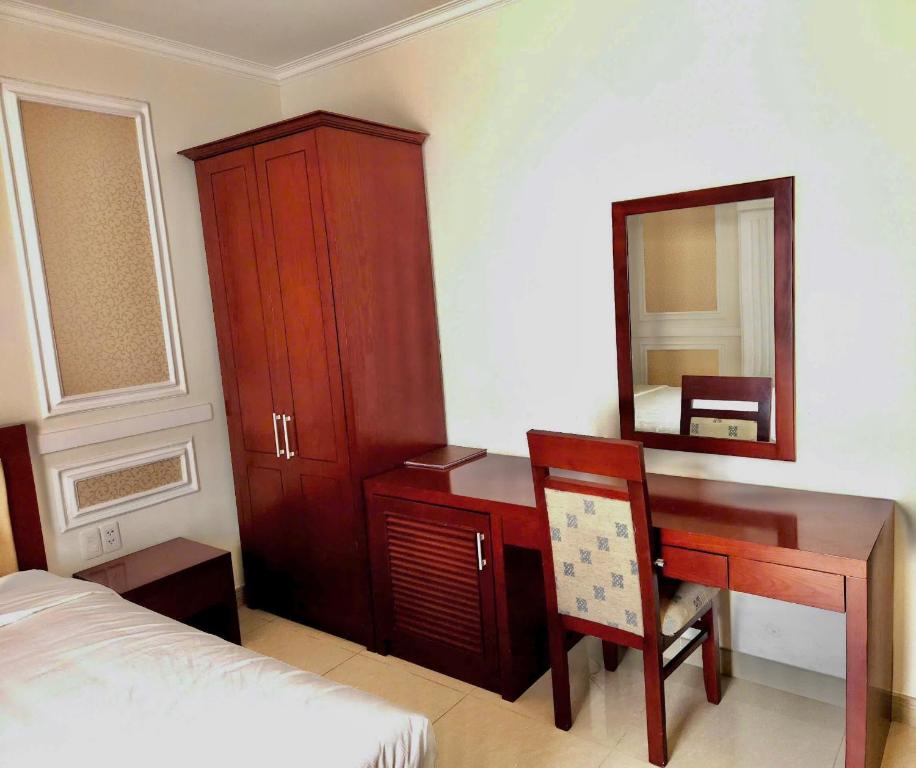 Postel nebo postele na pokoji v ubytování Lychees' Hotel