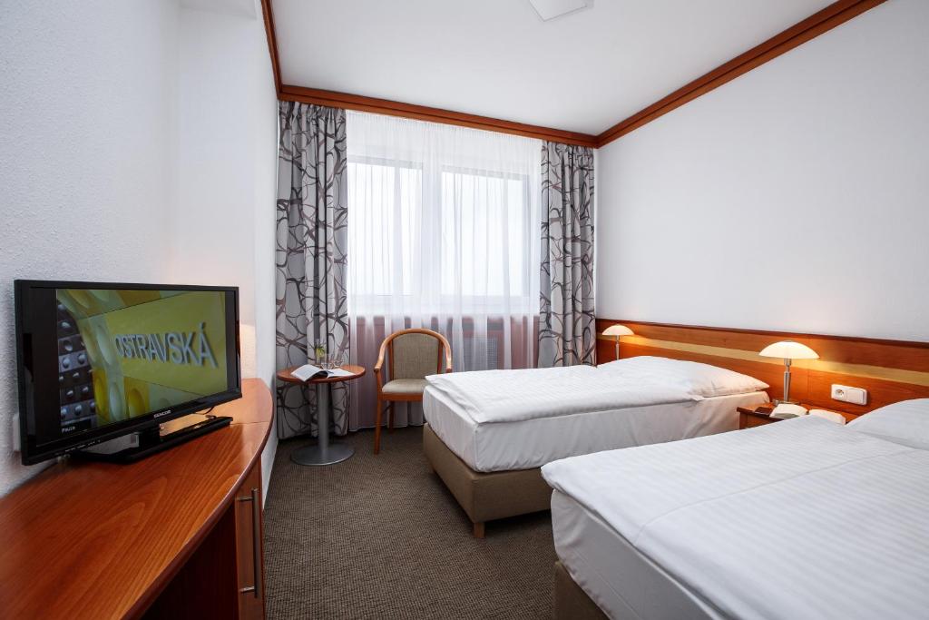 Postel nebo postele na pokoji v ubytování Harmony Club Hotel