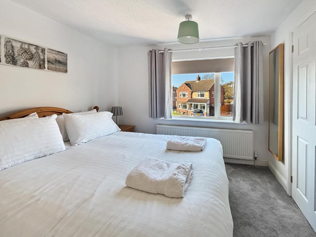 Ένα ή περισσότερα κρεβάτια σε δωμάτιο στο Amaya Nine Sleeps 7 Large 4 bed house - Bottesford