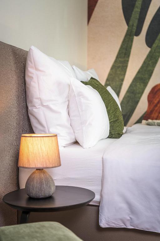Postel nebo postele na pokoji v ubytování Hotel DAS SAAL