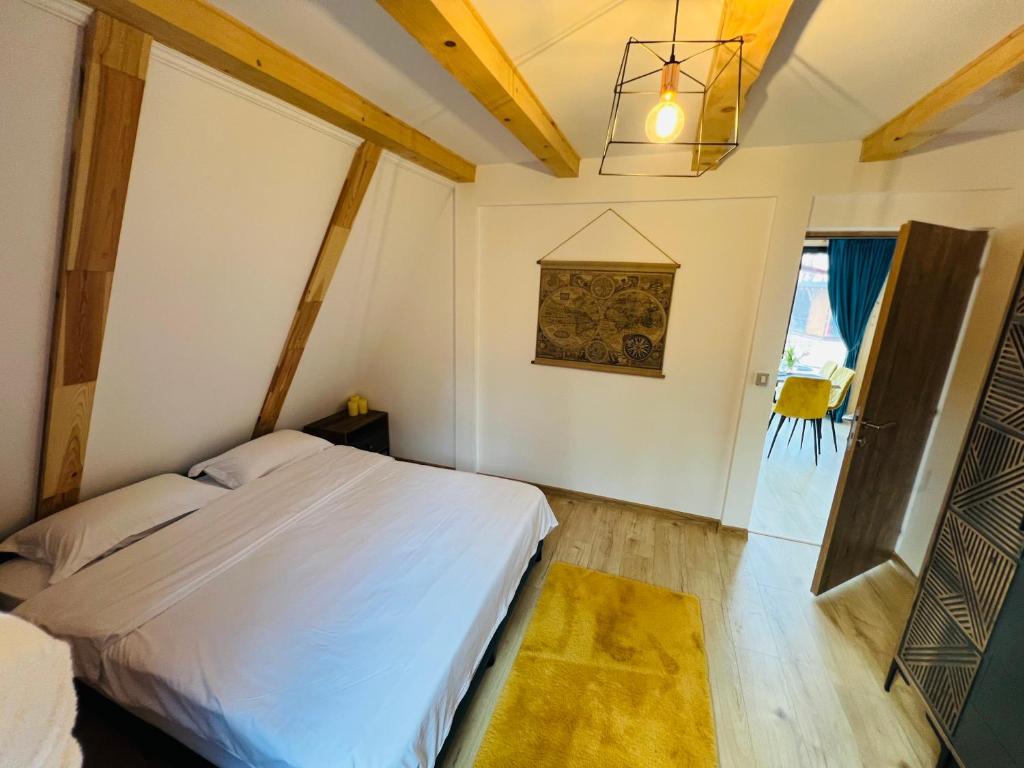 Postel nebo postele na pokoji v ubytování A-frame Marisa Vadu Crisului