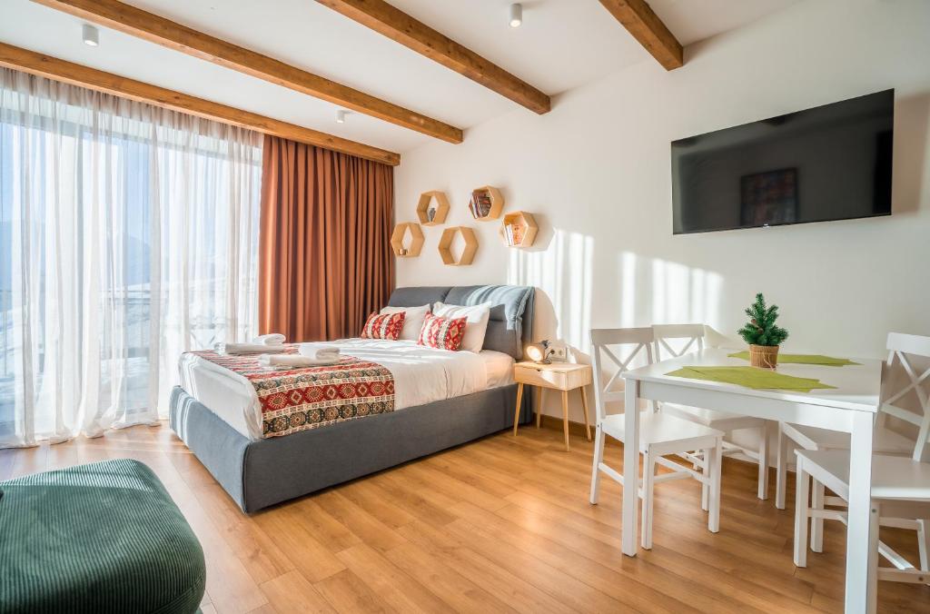 Postel nebo postele na pokoji v ubytování New Gudauri GN Apartments in Atrium