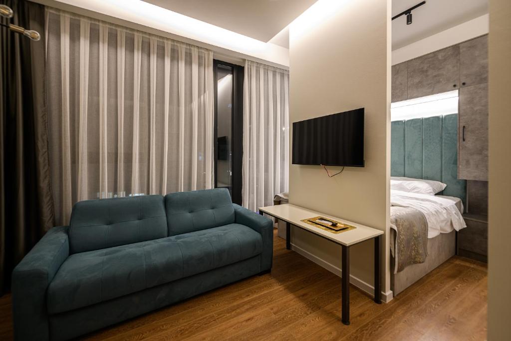 Postel nebo postele na pokoji v ubytování AXIOM Apartments