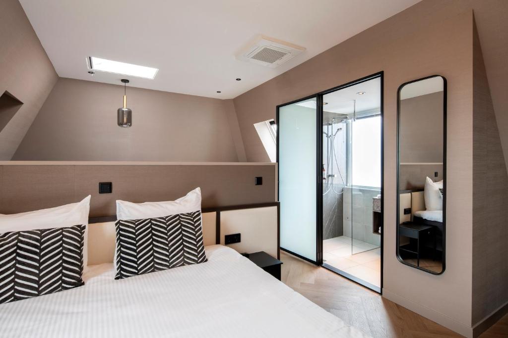 Postel nebo postele na pokoji v ubytování Breathe Boutique Hotel