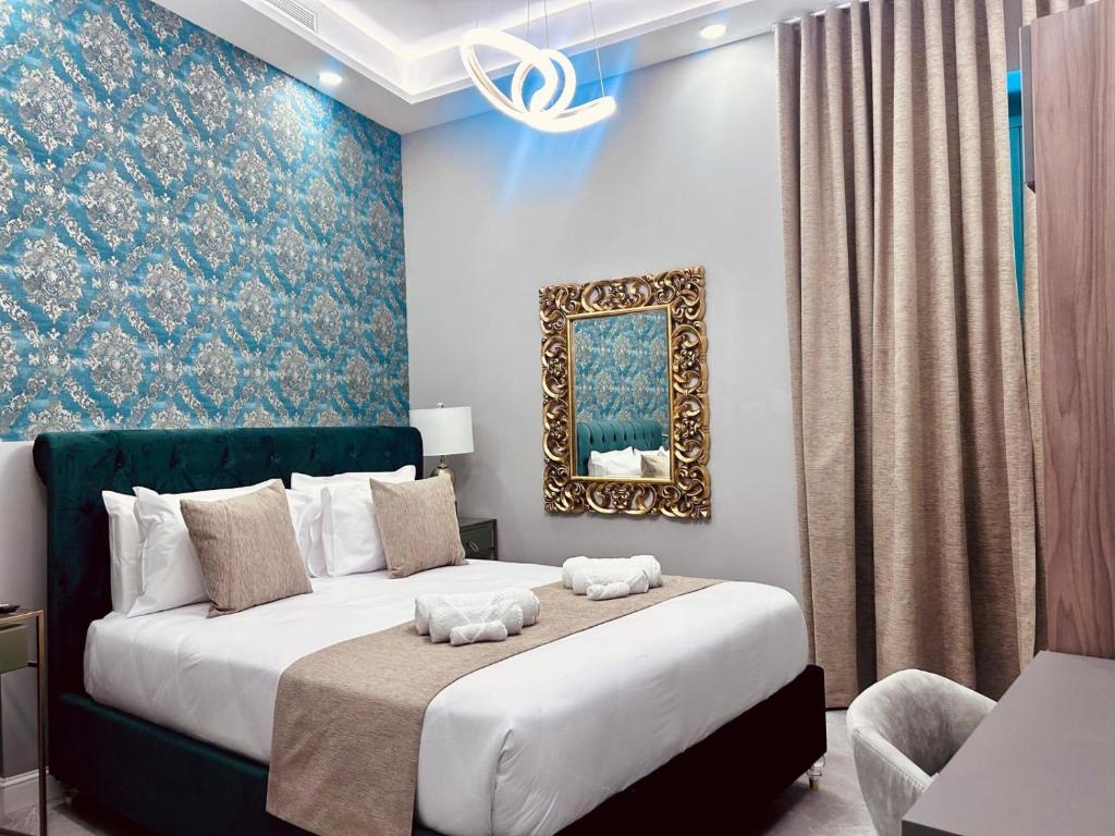 Postel nebo postele na pokoji v ubytování Howard House Hotel