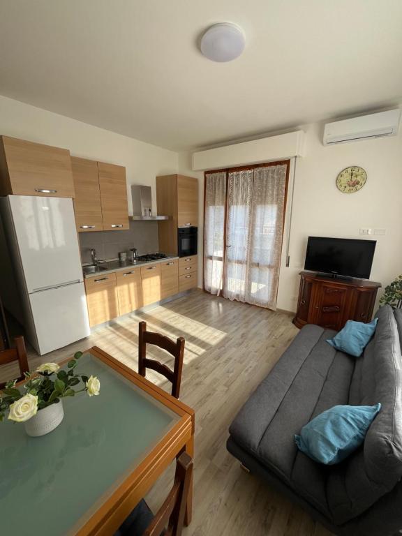 a living room with a couch and a table at casa pontorme in Empoli