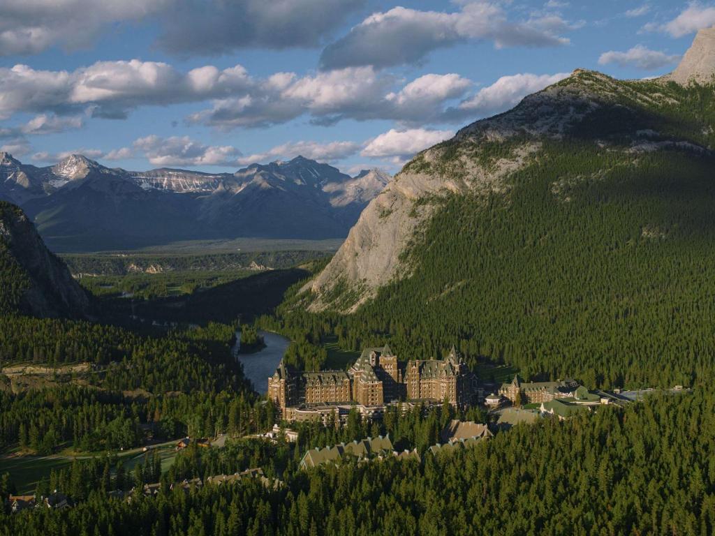 a town in the middle of a valley with a mountain at Fairmont Banff Springs in Banff