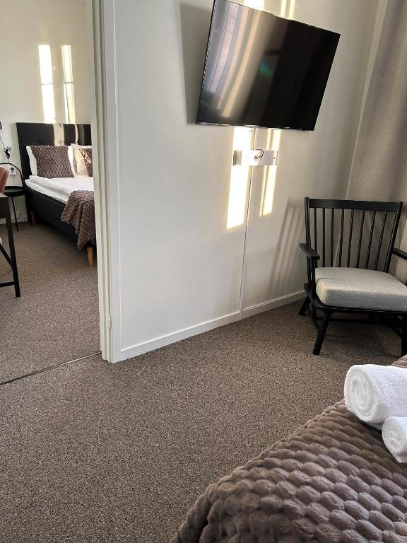 Postel nebo postele na pokoji v ubytování Grangärde Hotell