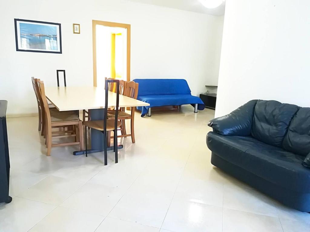 a living room with a couch and a table at Casa Elettra in Otranto in Otranto