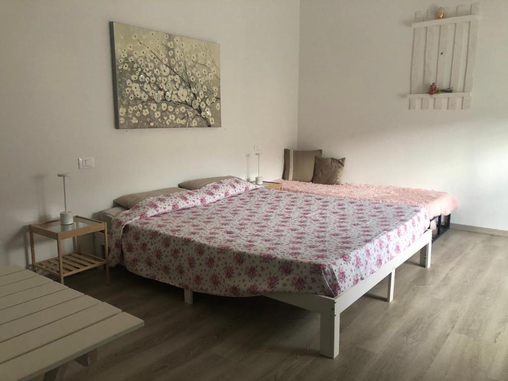 Postel nebo postele na pokoji v ubytování R&B MiDora Modena