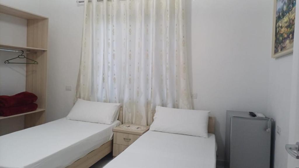 Postel nebo postele na pokoji v ubytování Hotel Sherifaj