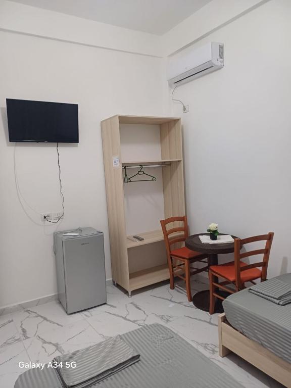 TV a/nebo společenská místnost v ubytování Hotel Sherifaj