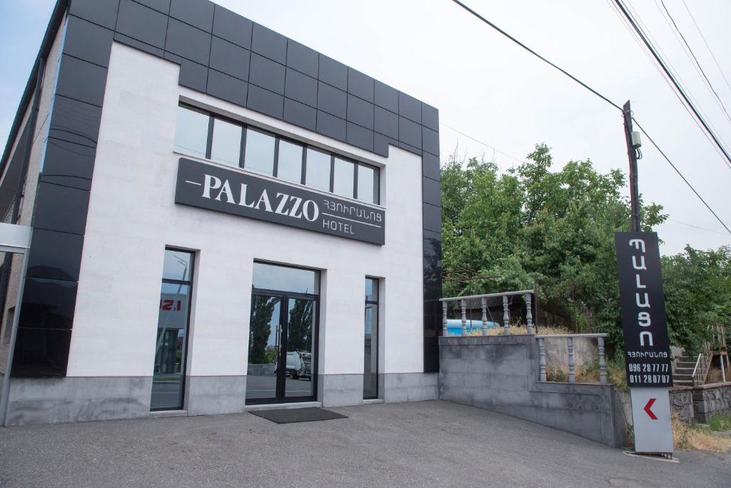 a building with a sign that reads paladinota at Palazzo Hotel in Yerevan