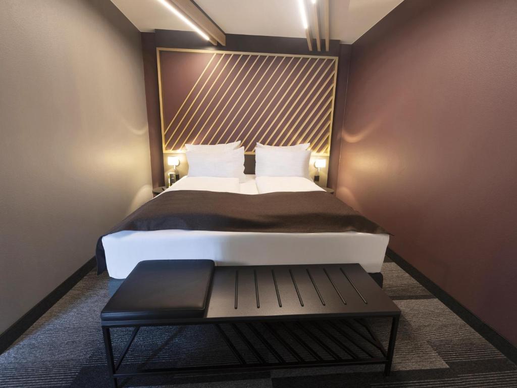 Postel nebo postele na pokoji v ubytování B&B HOTEL Gera