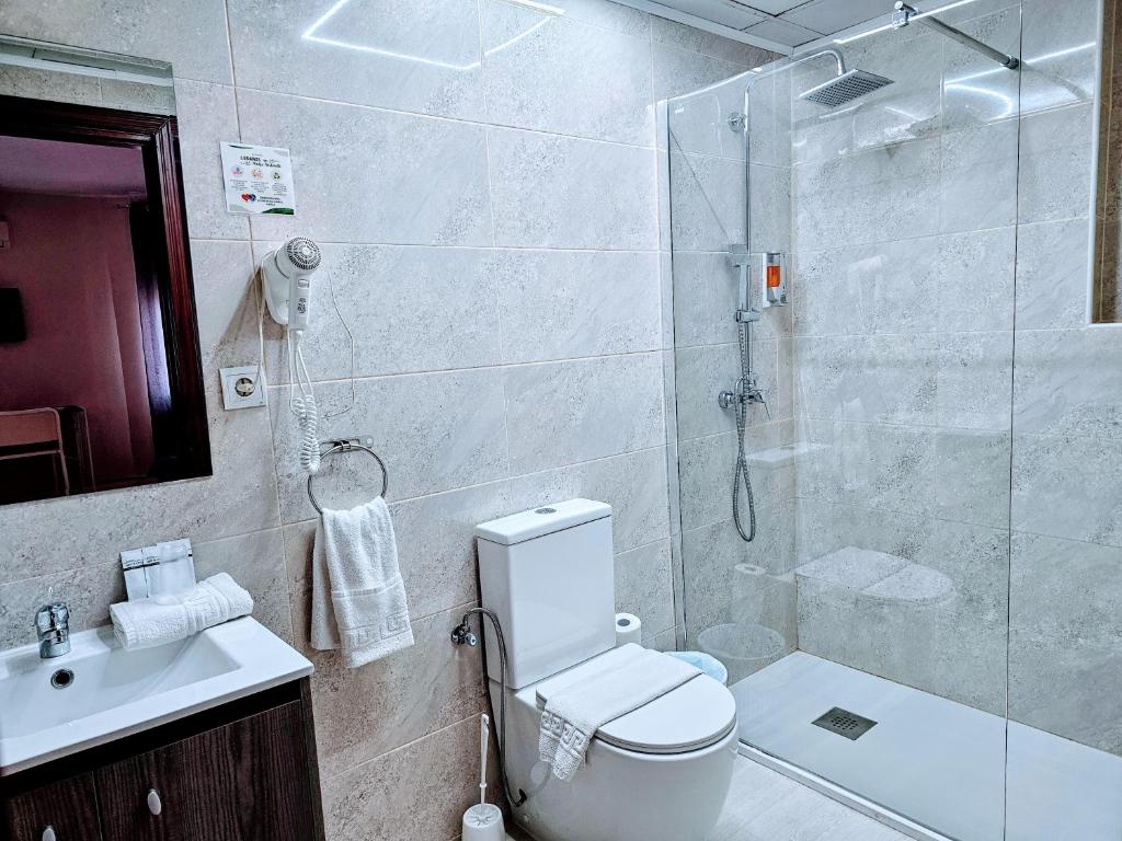 Koupelna v ubytování Hotel Velis
