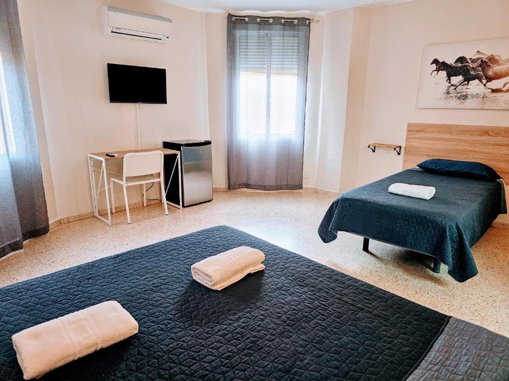 Postel nebo postele na pokoji v ubytování Hotel Velis