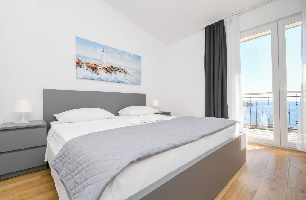 Posteľ alebo postele v izbe v ubytovaní Apartments Rose