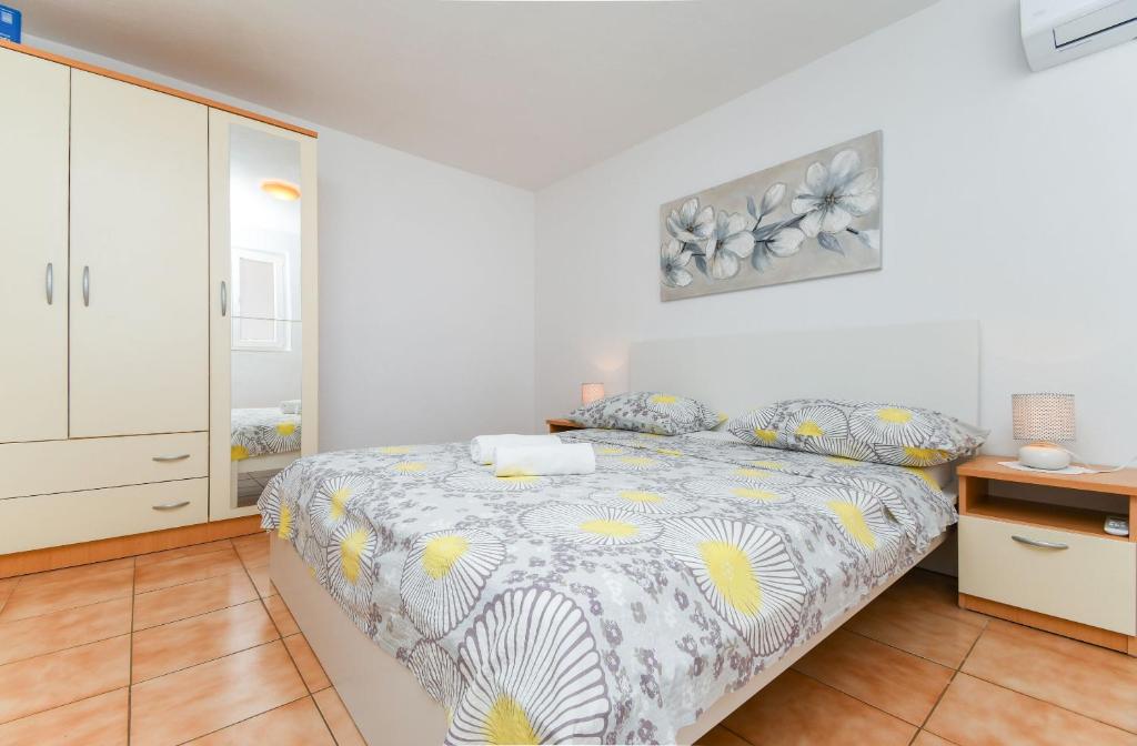 Posteľ alebo postele v izbe v ubytovaní Apartments Rose