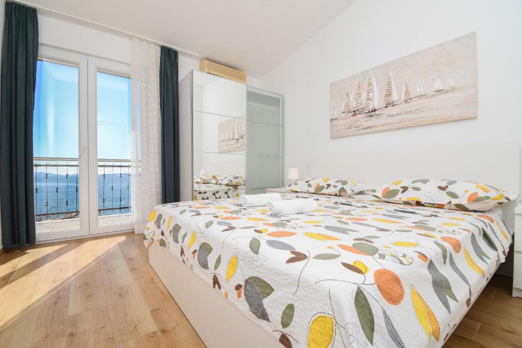 Posteľ alebo postele v izbe v ubytovaní Apartments Rose