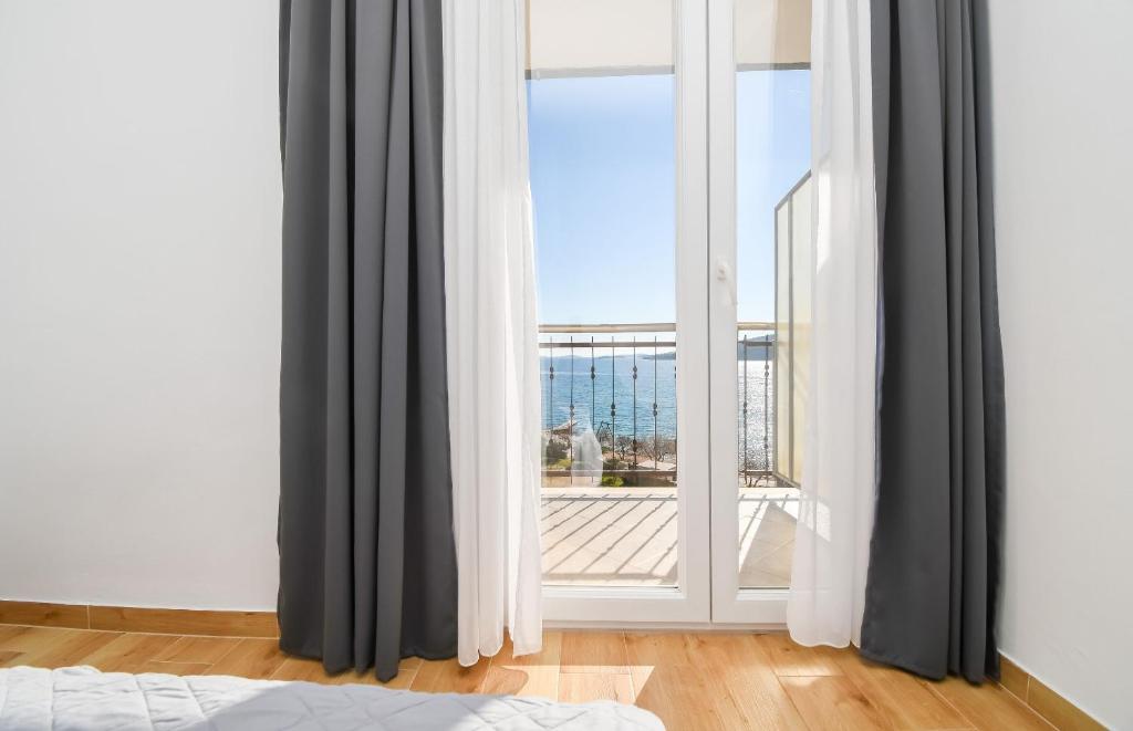 Posteľ alebo postele v izbe v ubytovaní Apartments Rose
