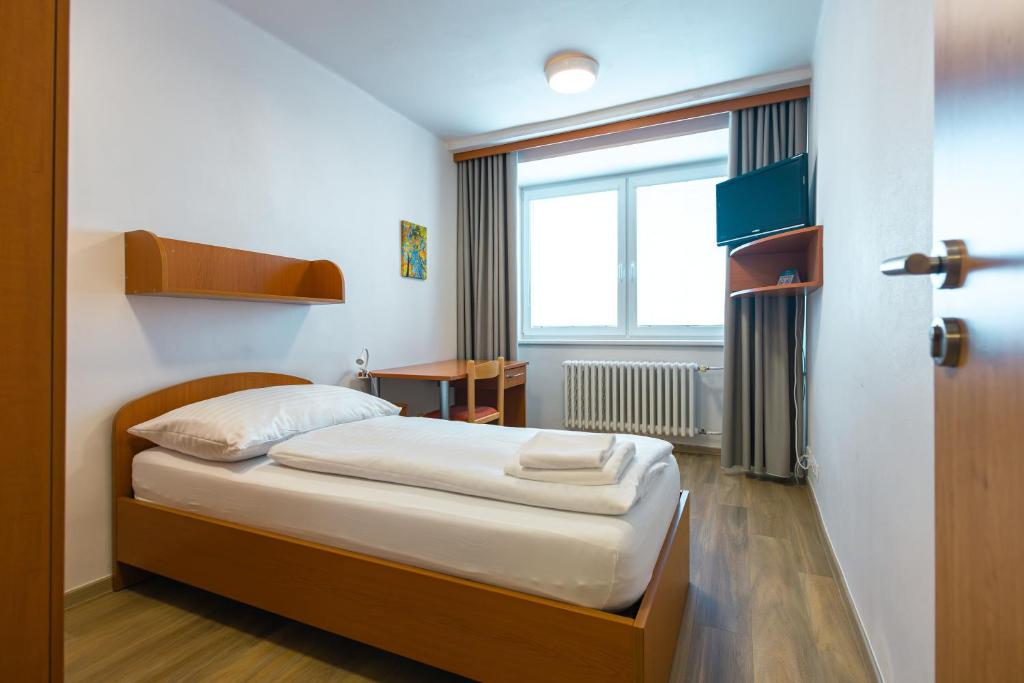 Postel nebo postele na pokoji v ubytování Hotel Garni VŠB TUO