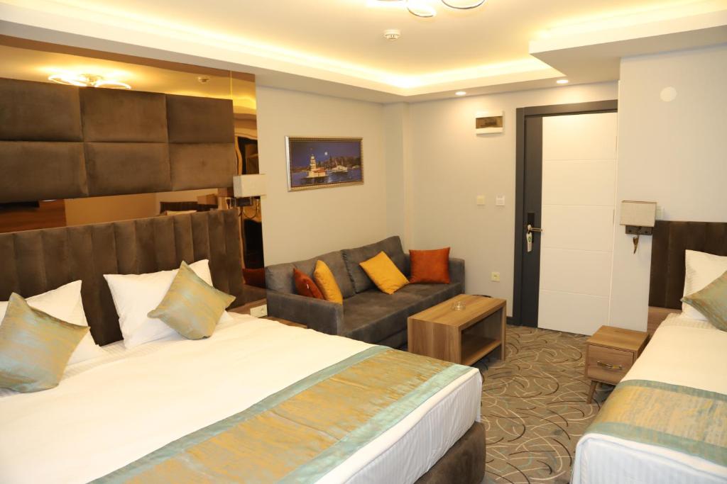 Postel nebo postele na pokoji v ubytování Grand Kavi Hotel