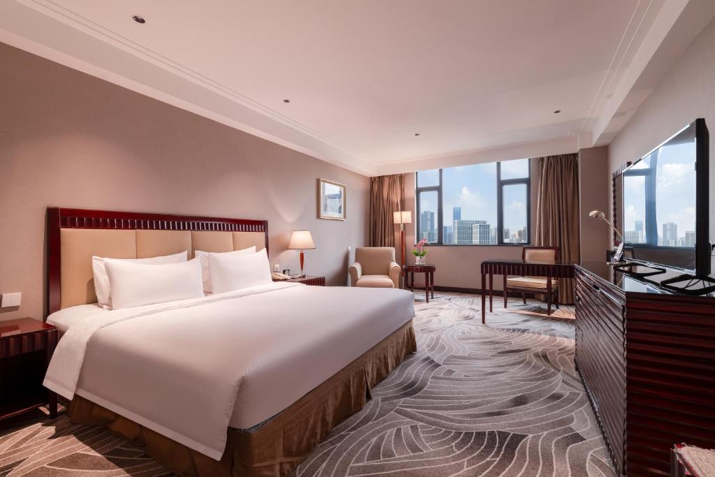 Voodi või voodid majutusasutuse Wuhan Hongguang Hotel toas
