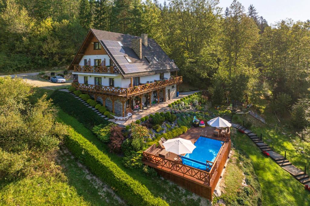 an aerial view of a house with a swimming pool at Tarninowe Wzgórze in Kunkowa