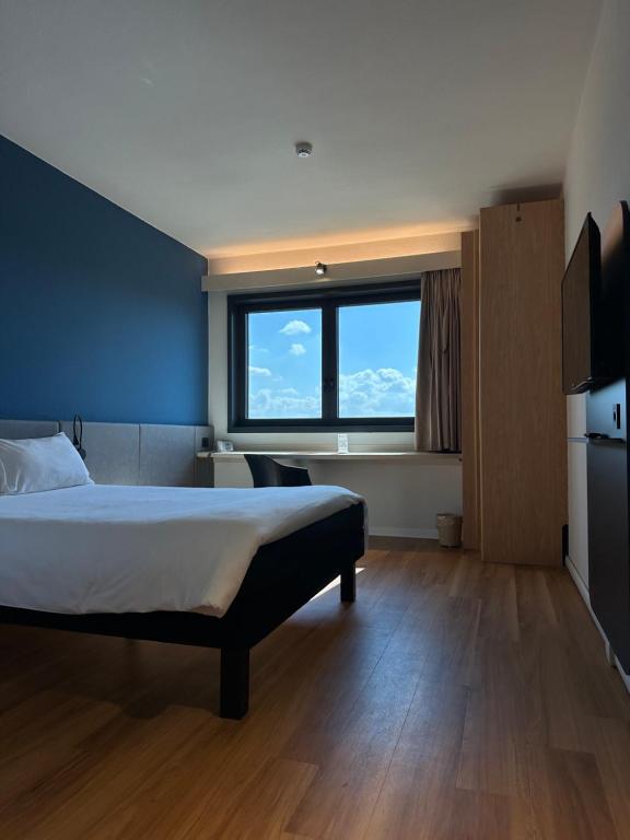 Postel nebo postele na pokoji v ubytování Ibis Roma Fiera