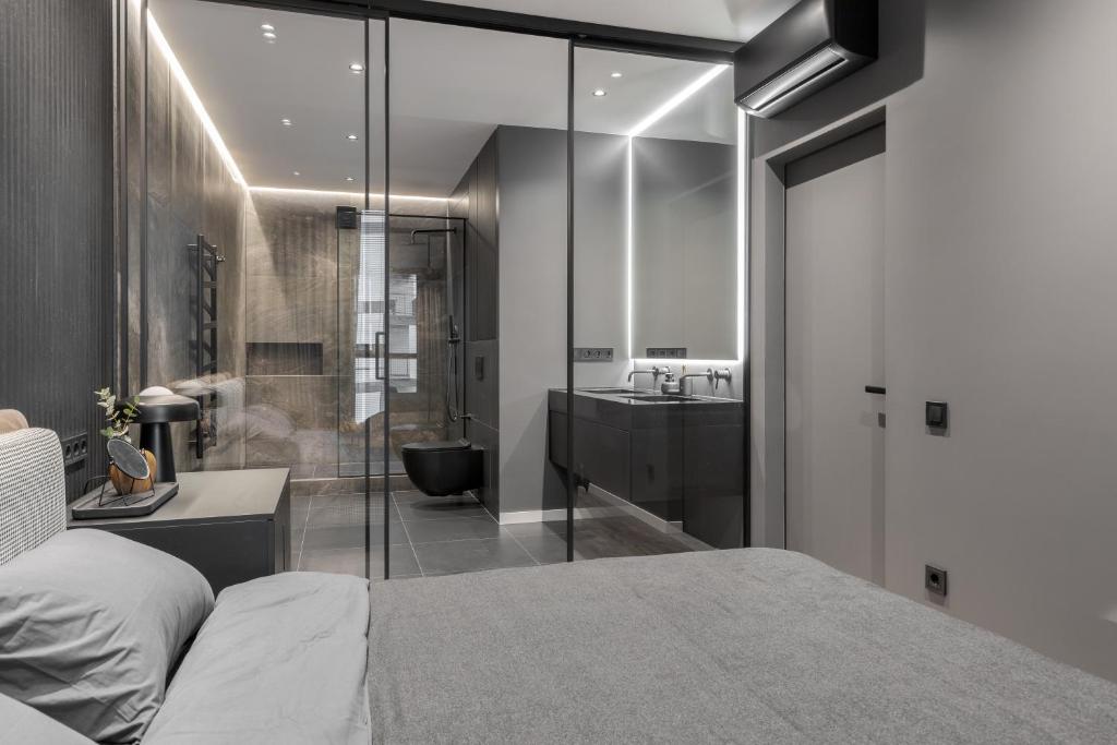 Кровать или кровати в номере AVALON on Lypynskogo street (New building)