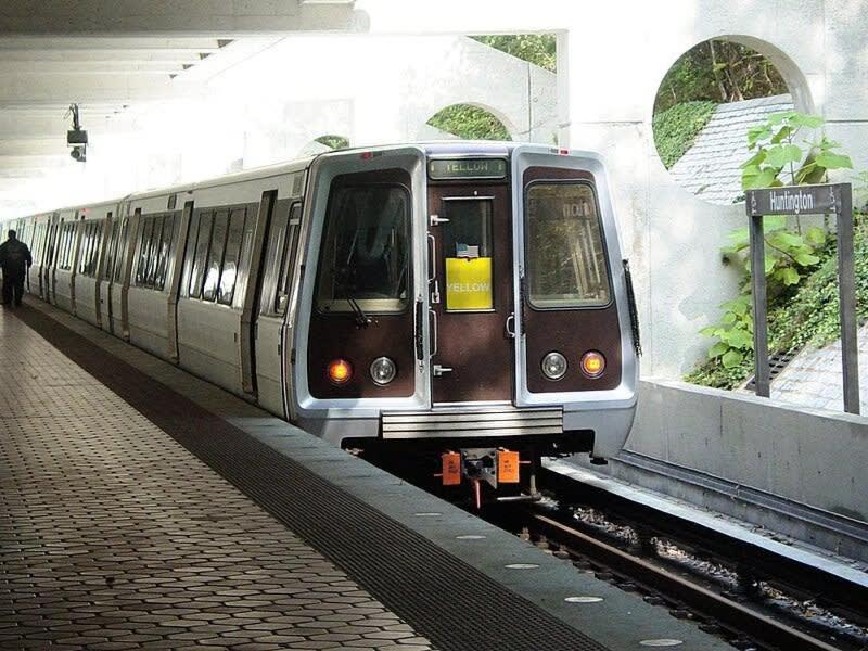 a subway train pulling into a subway station at ALX Cape Cod 3-BR Near Old Town & Mount Vernon in Alexandria