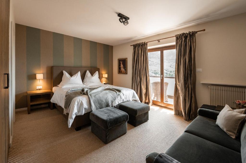 Postel nebo postele na pokoji v ubytování Hotel Chalet Gravenstein