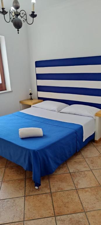 Postel nebo postele na pokoji v ubytování Sapphire Rooms