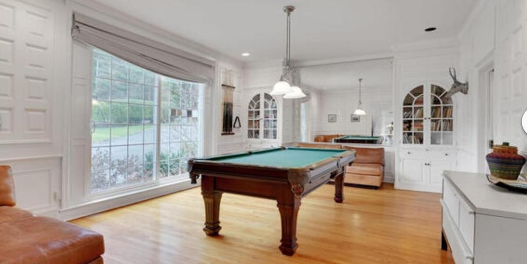 a living room with a pool table in it at Stunning, Large, Waterfront Retreat in Highlands