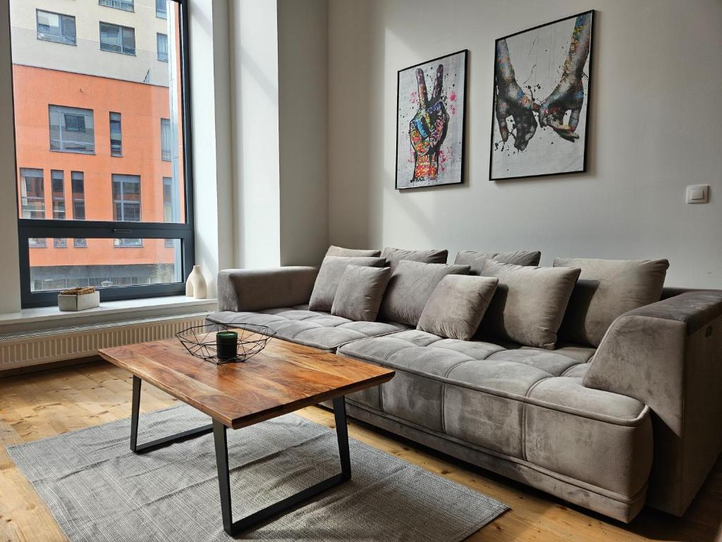 a living room with a couch and a coffee table at spacious modern LOFT, 2 bedrooms, 95m2, free parking in Bratislava