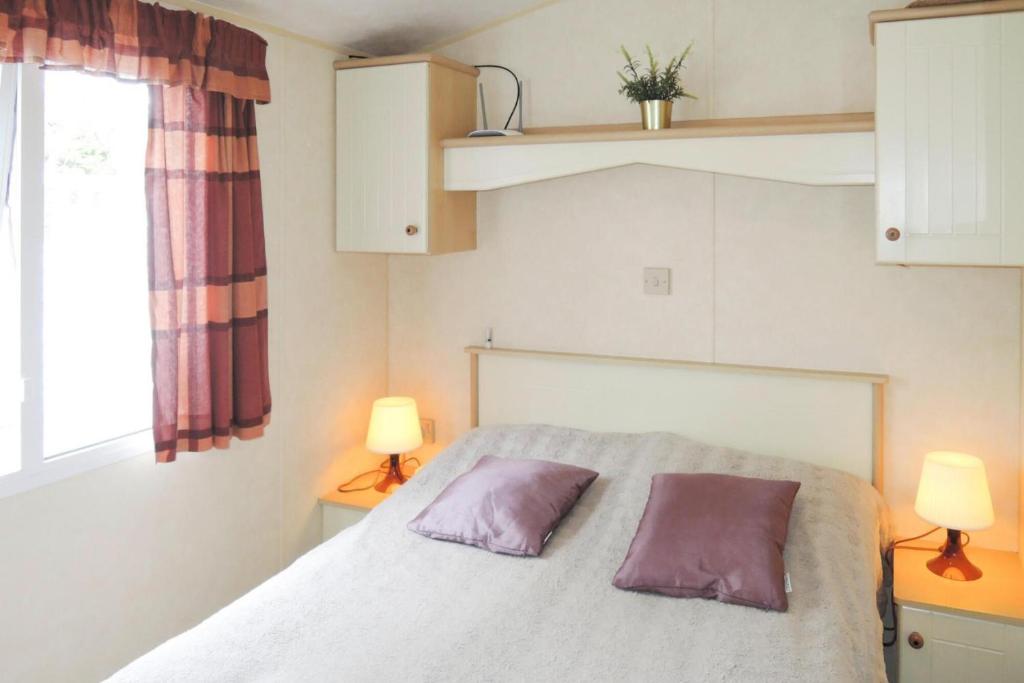 Posteľ alebo postele v izbe v ubytovaní Mobile home in Kolczewo with a terrace