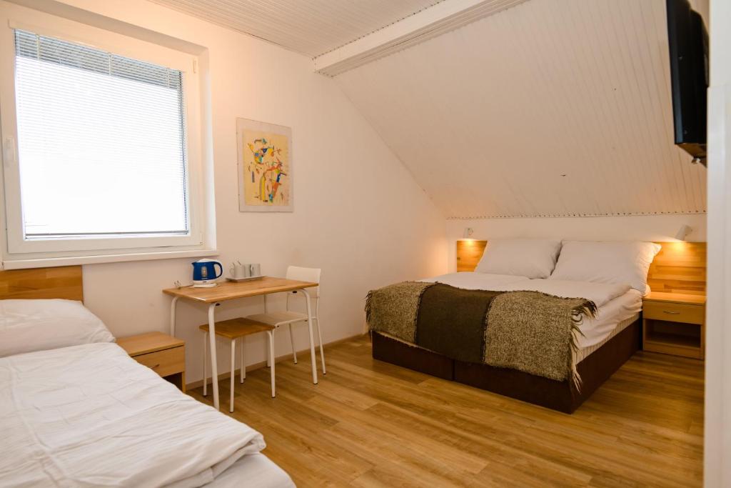 Postel nebo postele na pokoji v ubytování Wellness Vila Bohemia