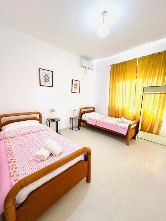 Giường trong phòng chung tại C Villa