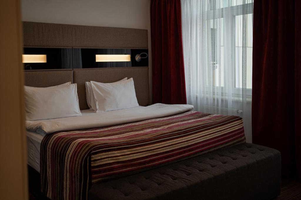Postel nebo postele na pokoji v ubytování 11 Mirrors Design Hotel
