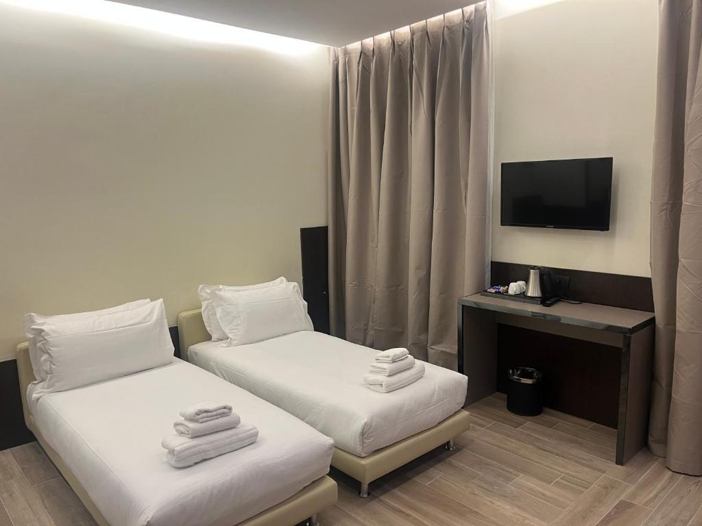 Postel nebo postele na pokoji v ubytování Jr Hotels Bocconi Milano