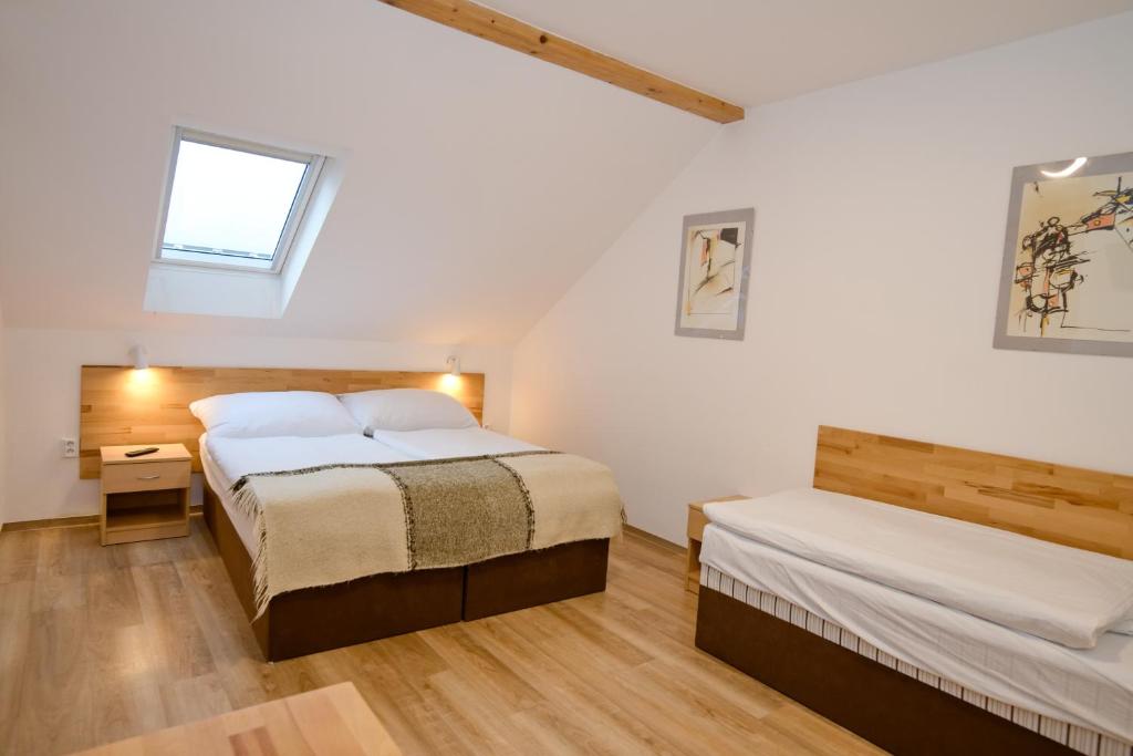 Postel nebo postele na pokoji v ubytování Wellness Vila Bohemia